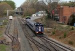 RNCX 1869 on the rear of train P075-25 as it shoves toward the station